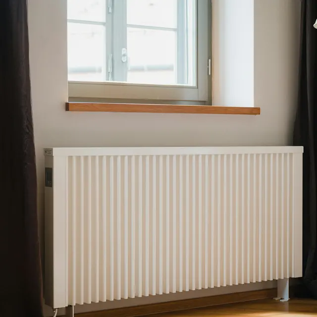 White panel radiator under a window
