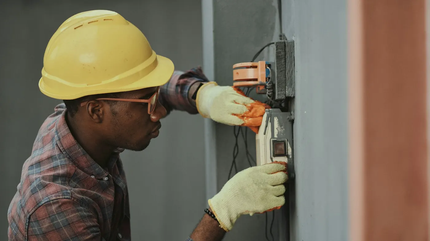 Electrician fault finding on a distribution board